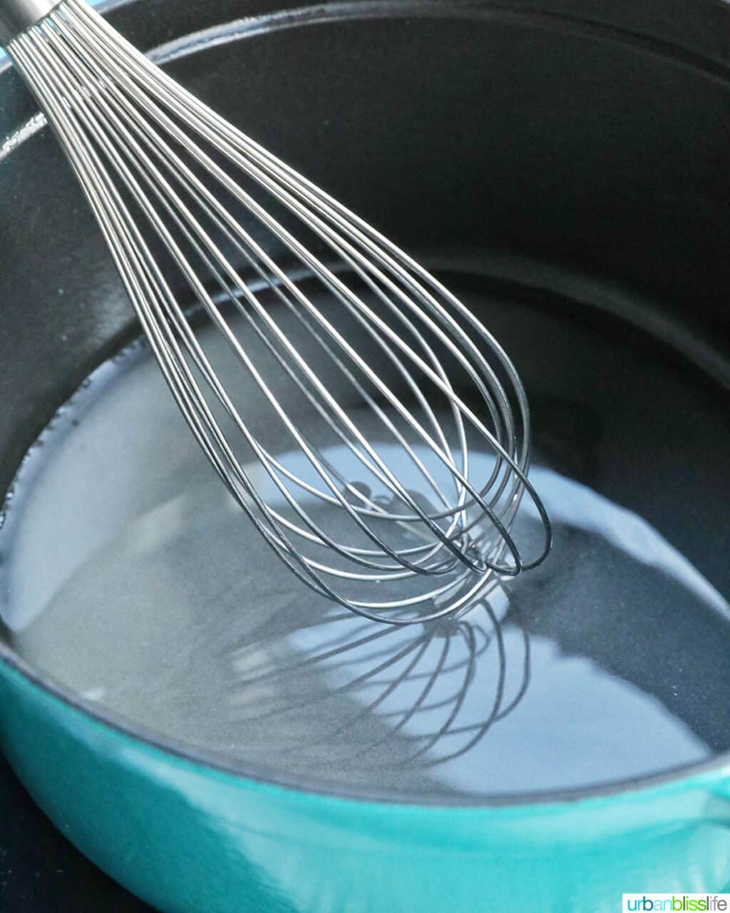 whisking simple syrup for cake, cocktails