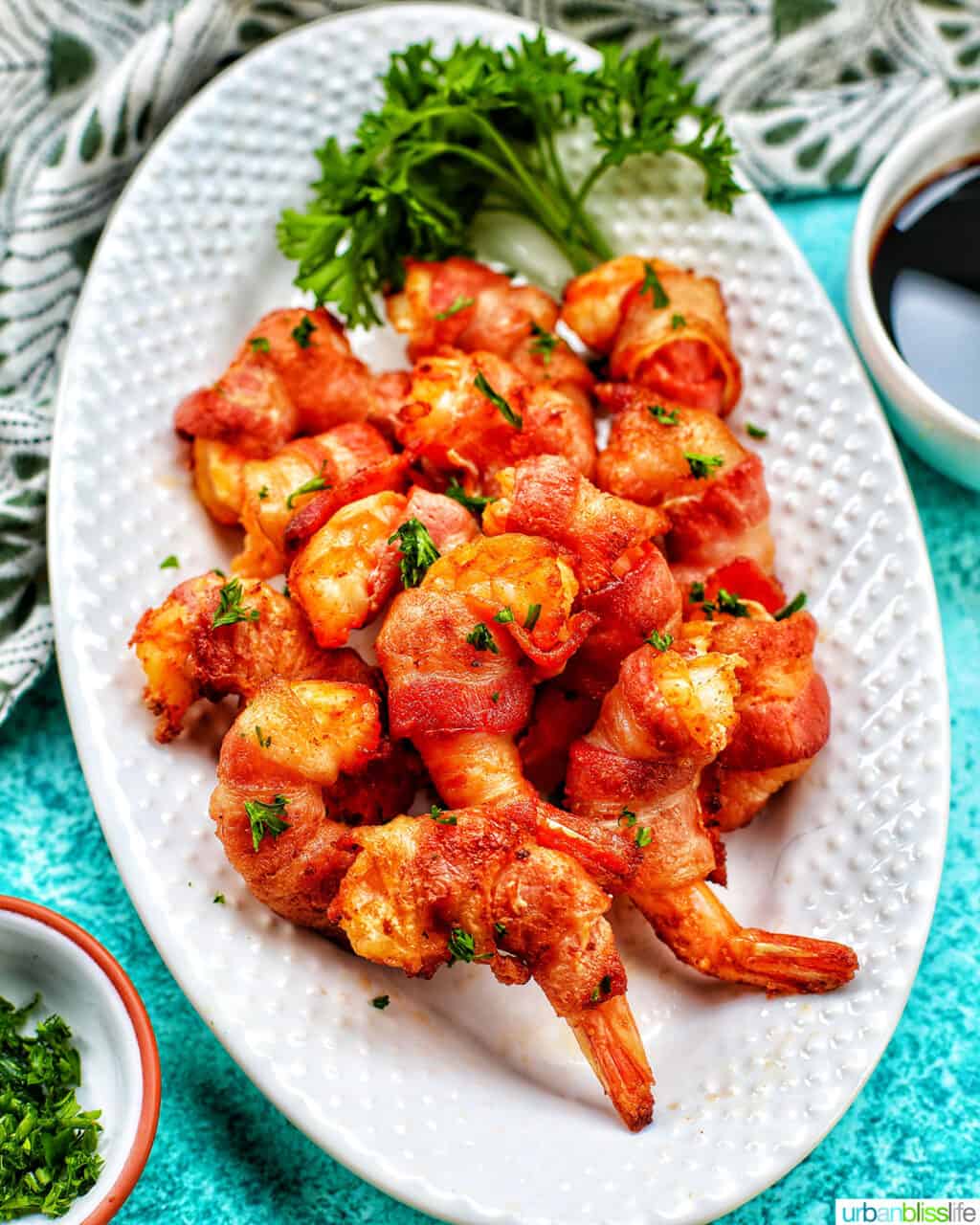 air fryer bacon wrapped shrimp on a white plate