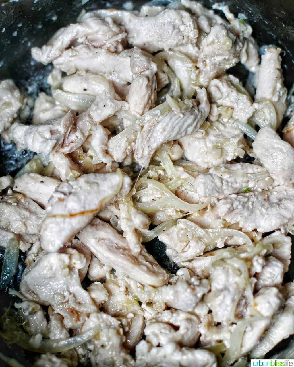 cooking chicken for adding shrimp to Filipino pancit canton noodles