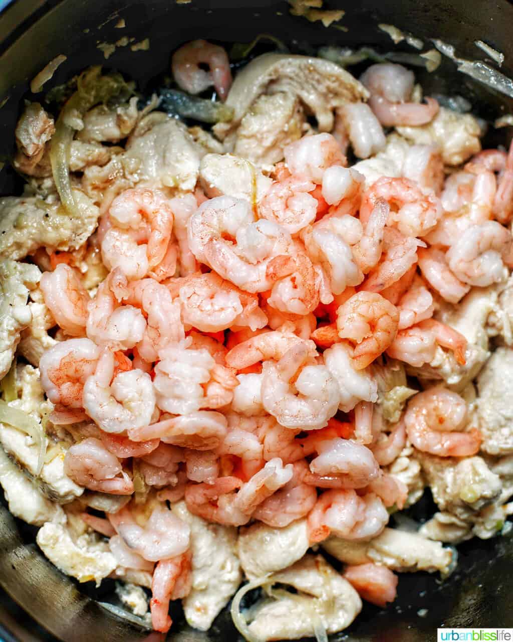 adding shrimp to Filipino pancit canton noodles