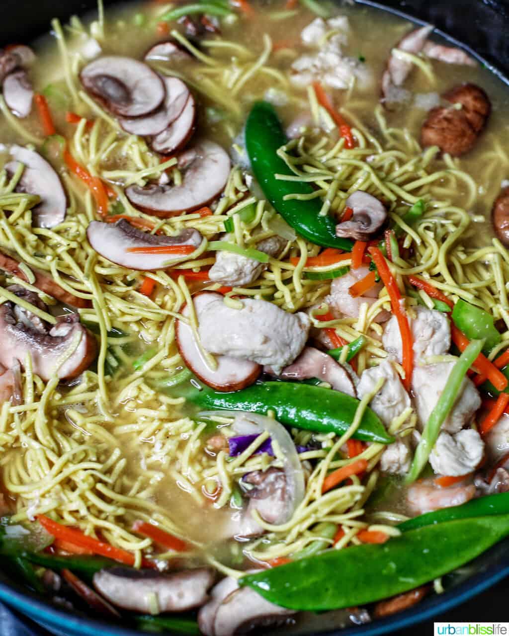 adding shrimp to Filipino pancit canton noodles