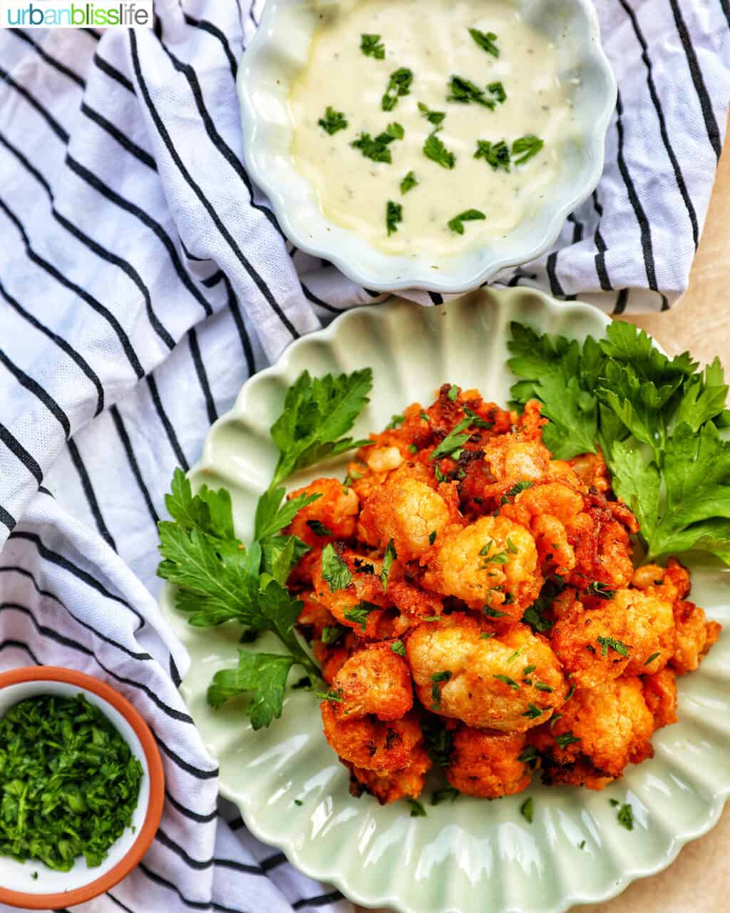 crispy air fryer buffalo cauliflower with sauce and parsley