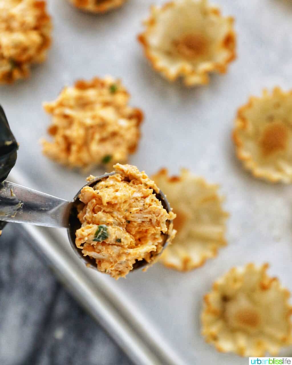 scooping up mix for buffalo chicken bites