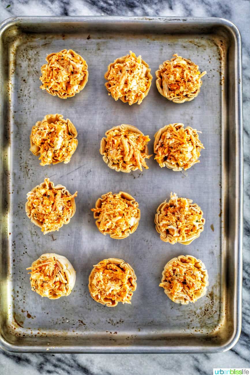 buffalo chicken bites on sheet pan ready to bake