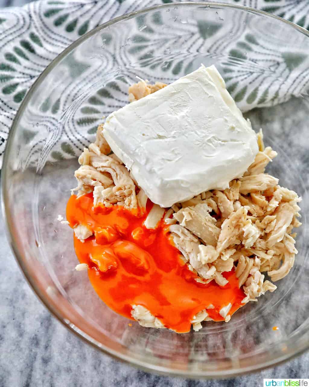ingredients mixing to make buffalo chicken bites