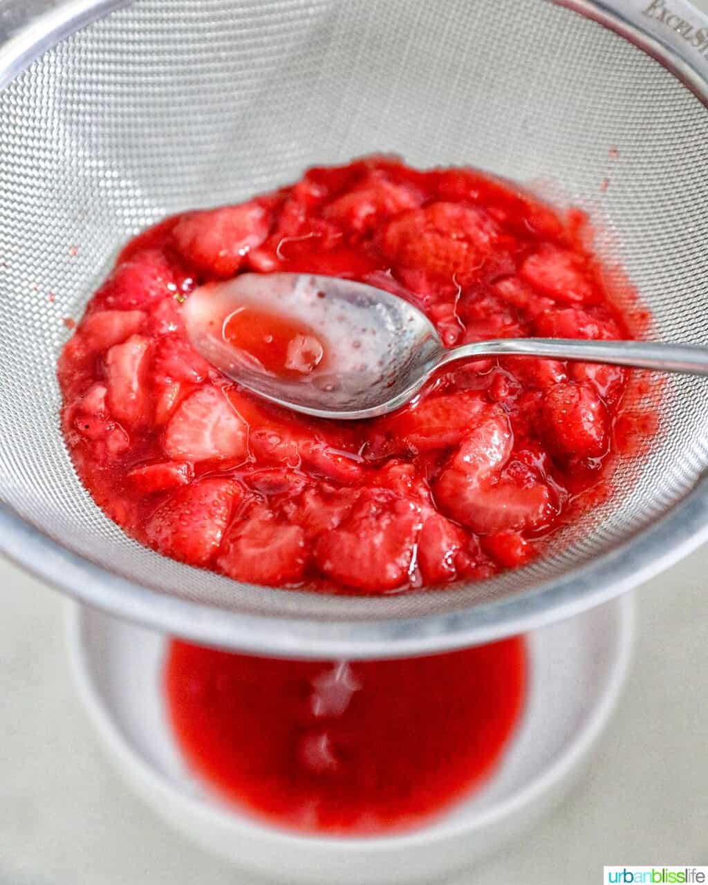 straining strawberries
