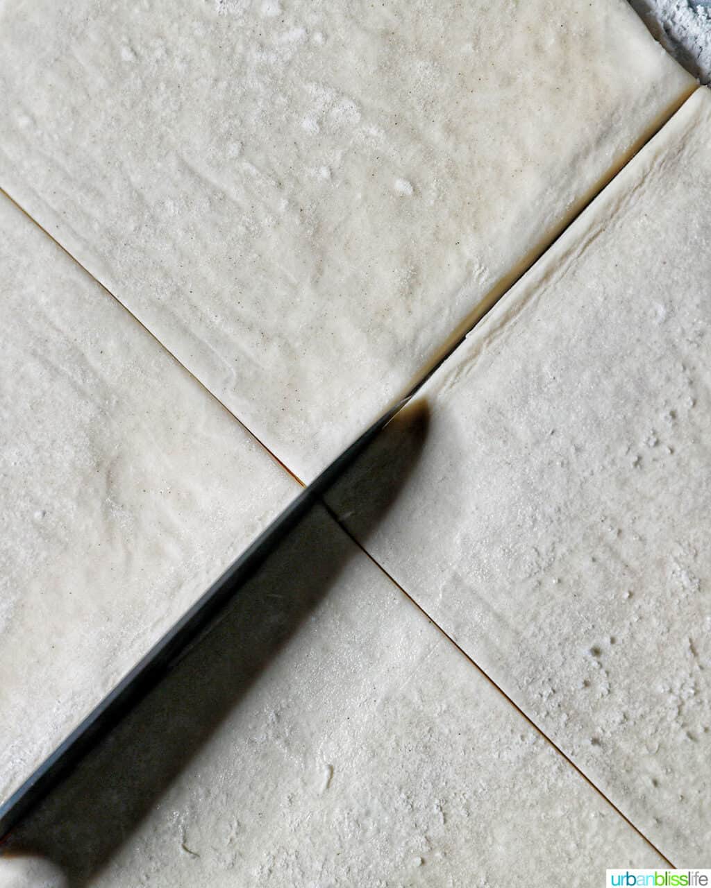knife slicing puff pastry