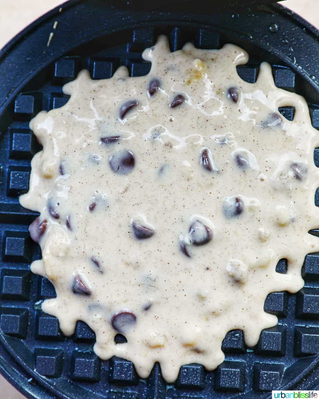 chocolate chip banana waffle batter in waffle iron