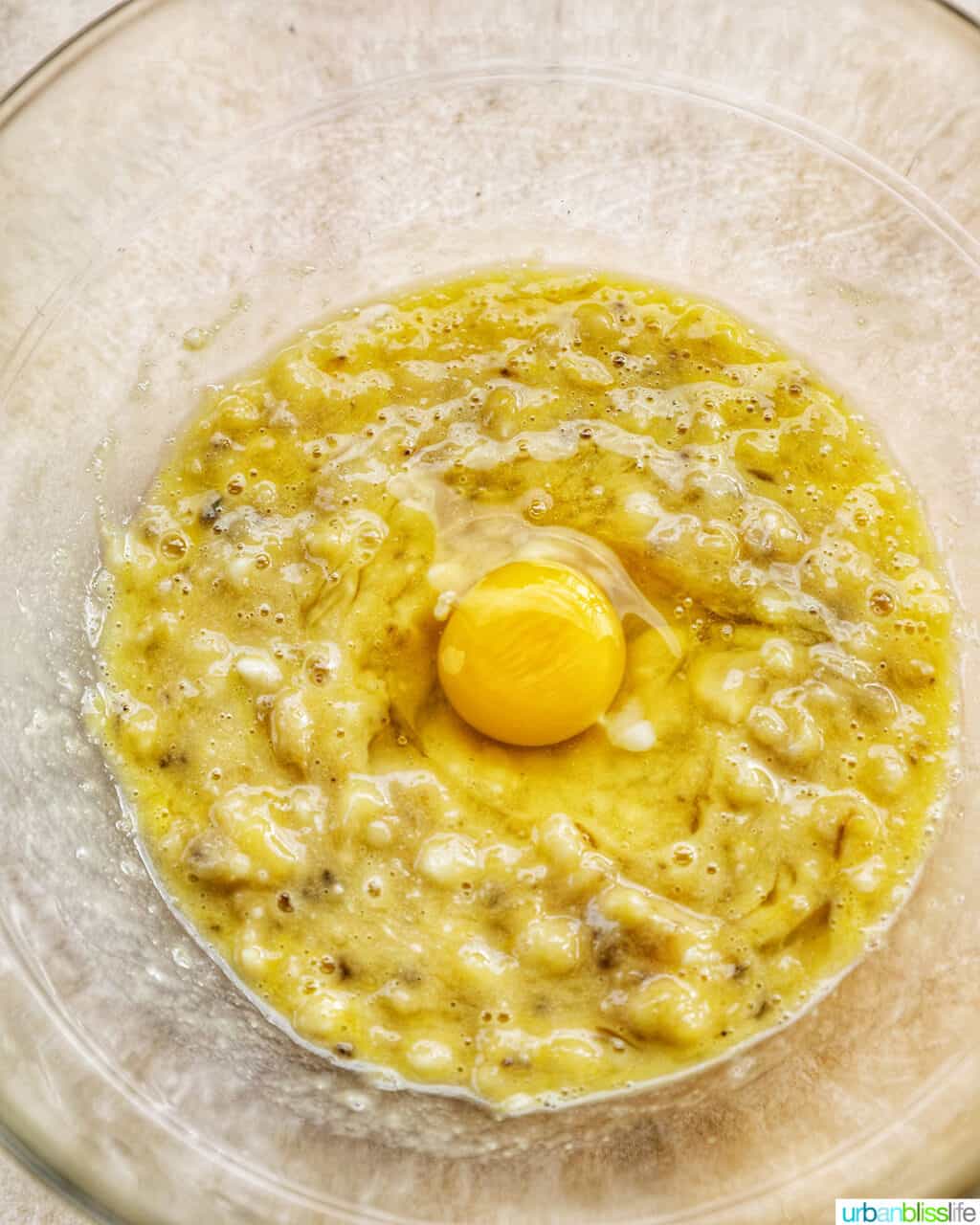 mixing an egg into the batter