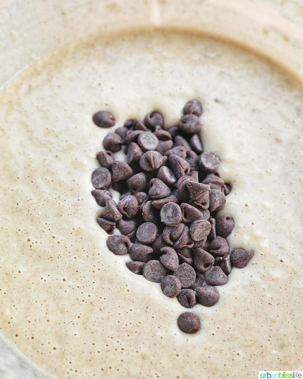 adding chocolate chips to batter