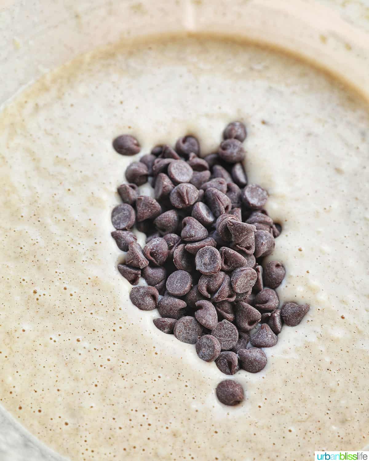 adding chocolate chips to batter