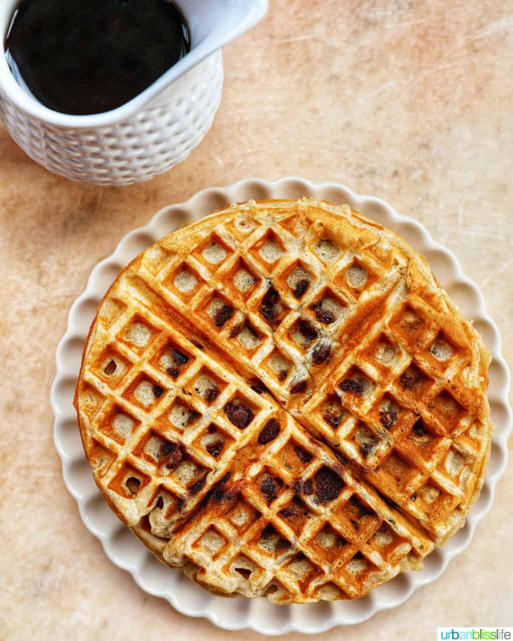 plate of banana chocolate chip waffles with syrup