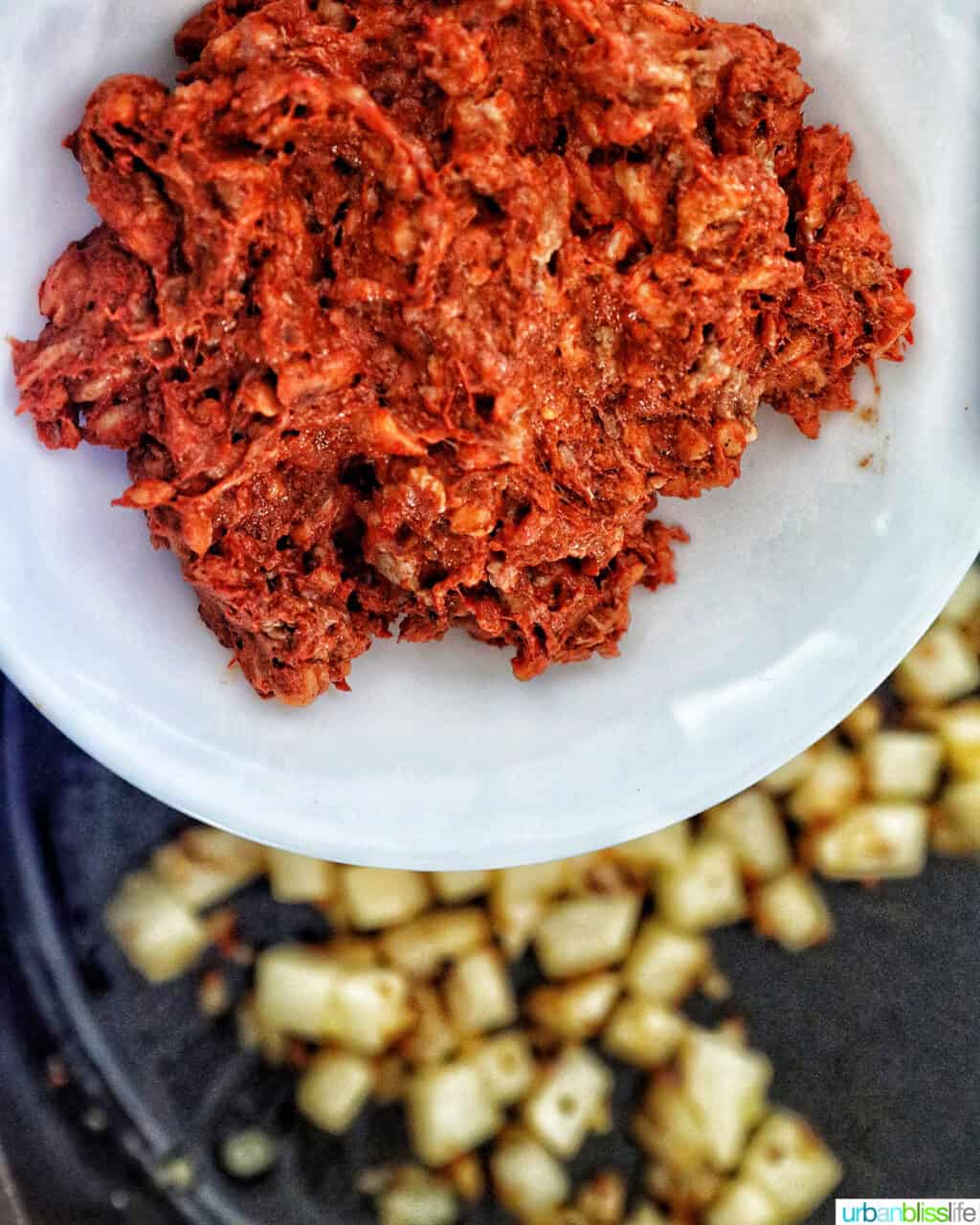 adding chorizo to pan