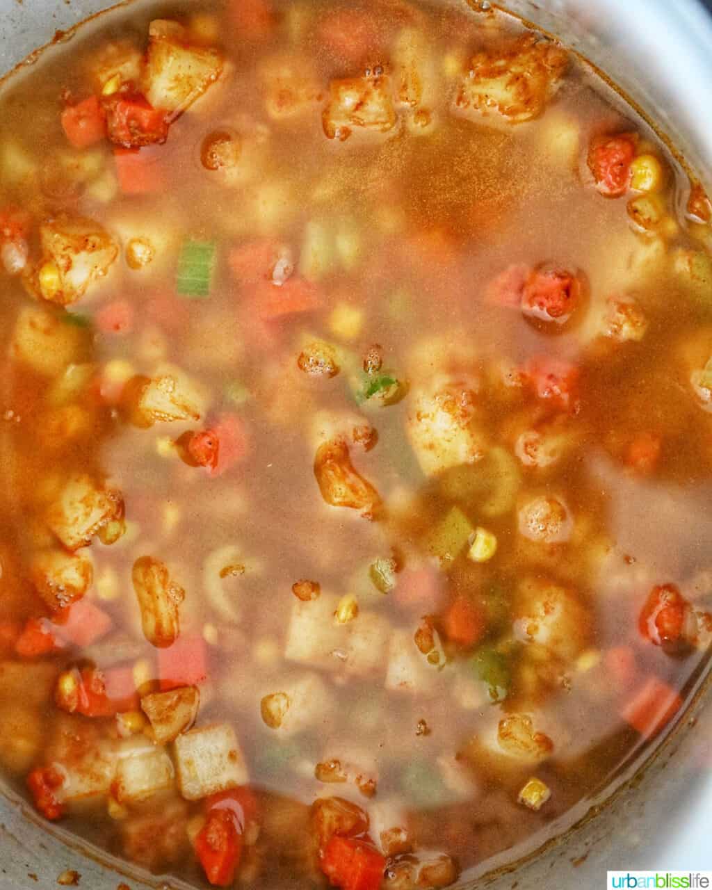 broth covering Instant Pot Potato Corn Chowder