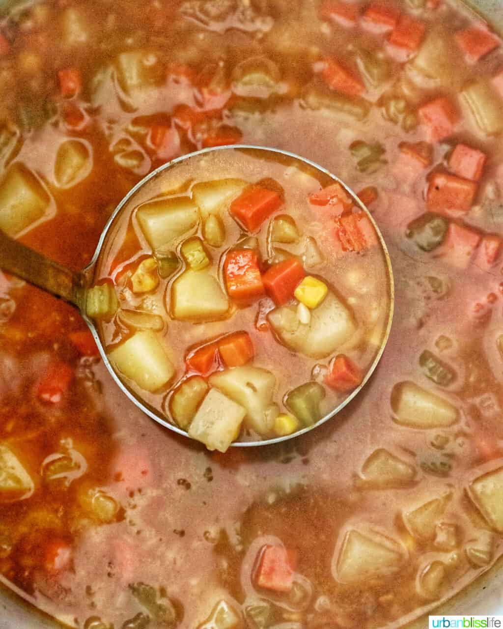 ladle of cooked Instant Pot Potato Corn Chowder