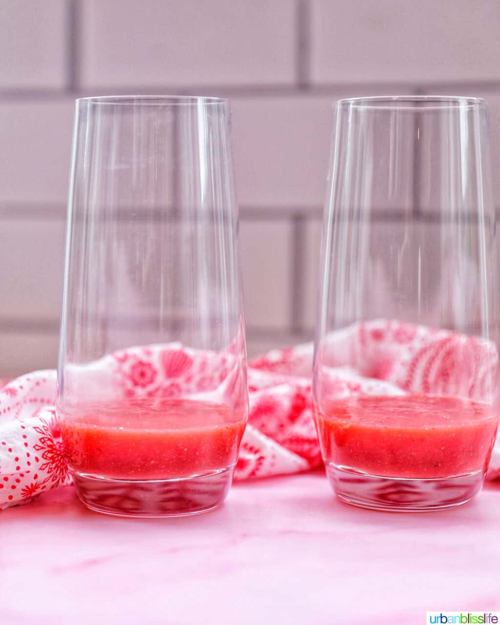 strawberry jam poured into two glasses