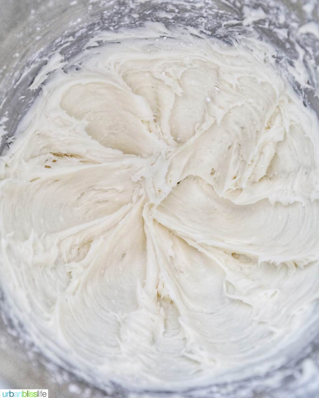 cream cheese frosting in a stand mixer bowl