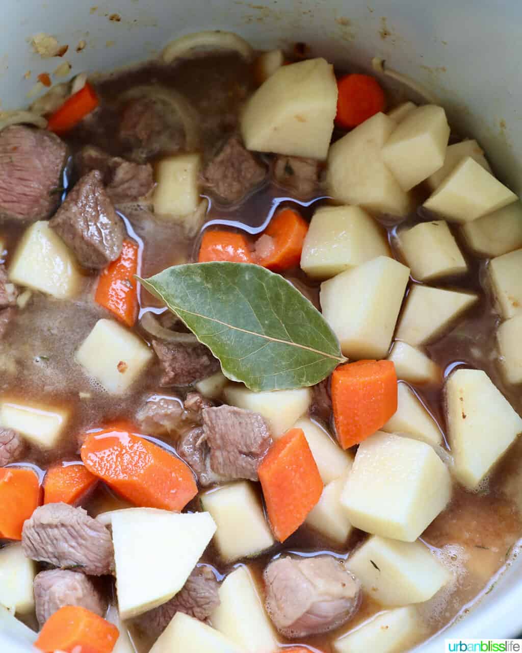 adding bay leaf to stew