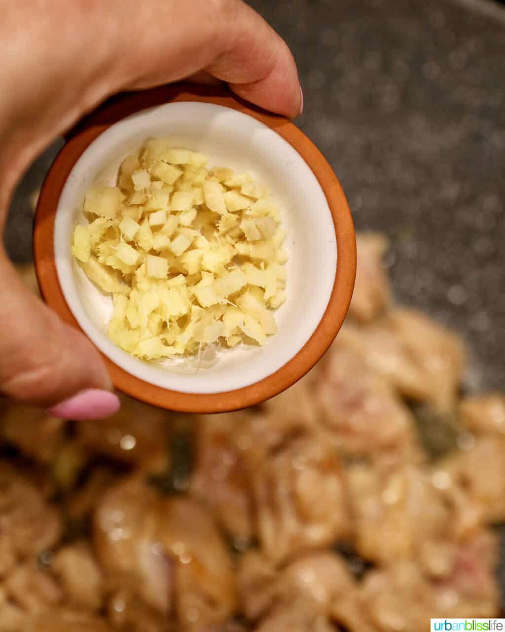 adding ginger to chicken