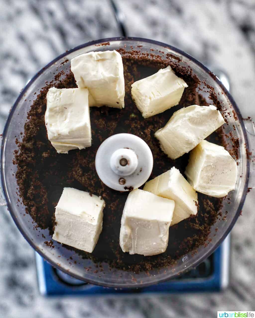 adding cream cheese to mint oreo truffles