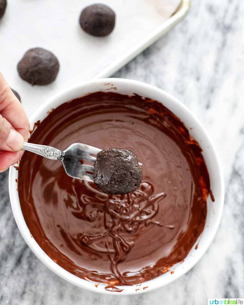 coating mint oreo truffles in chocolate