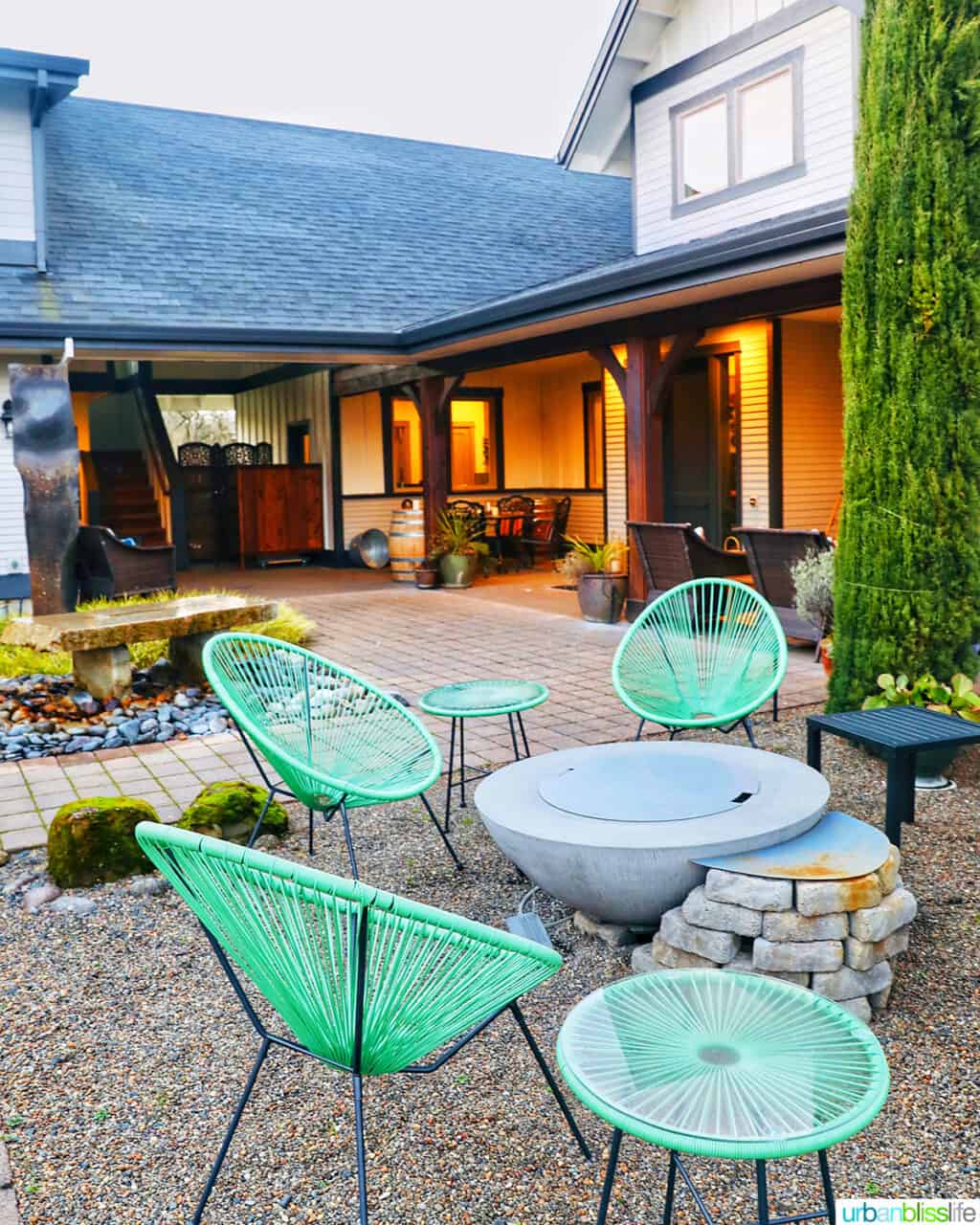 seagreen outdoor chairs in courtyard at The Setting Inn Willamette Valley