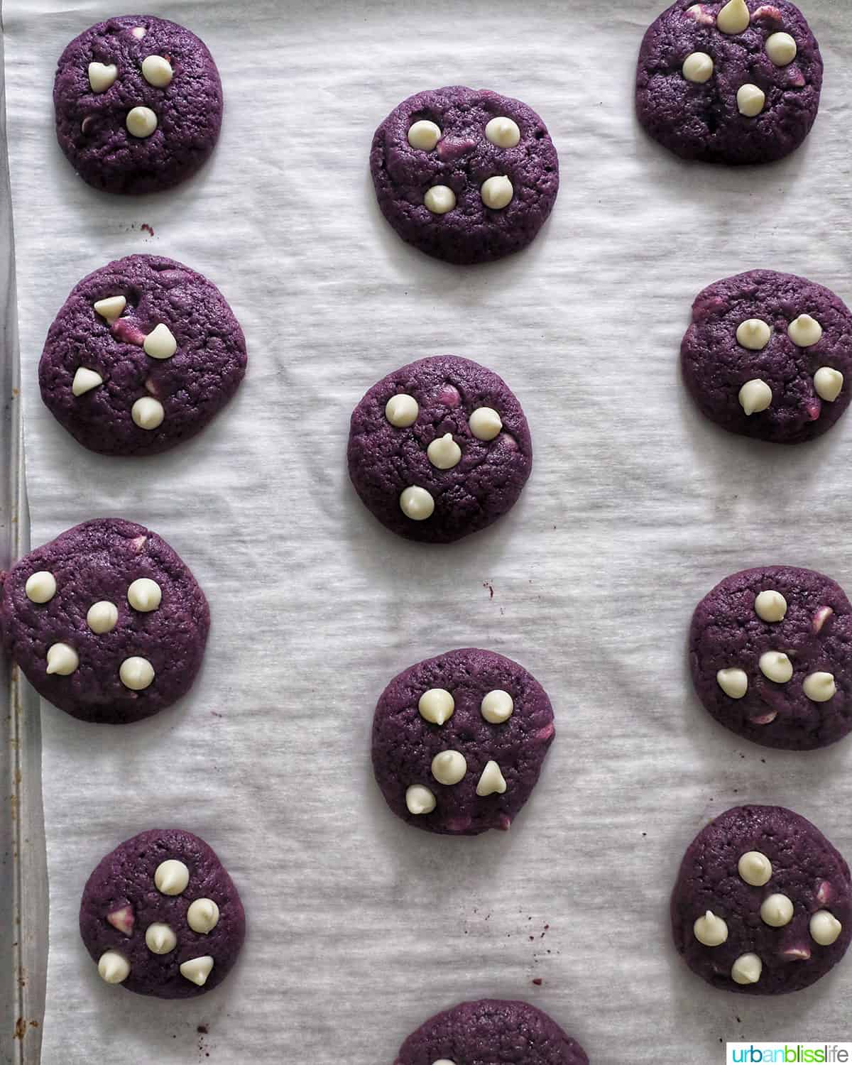 Ube white chocolate chip cookies on a baking sheet.