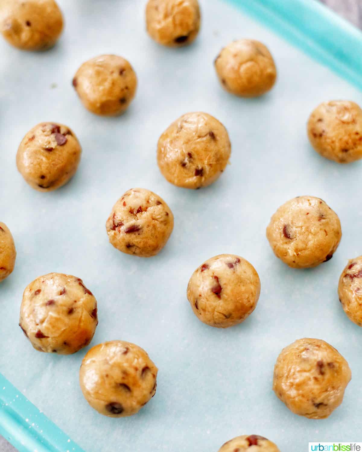 edible cookie dough balls on baking sheet