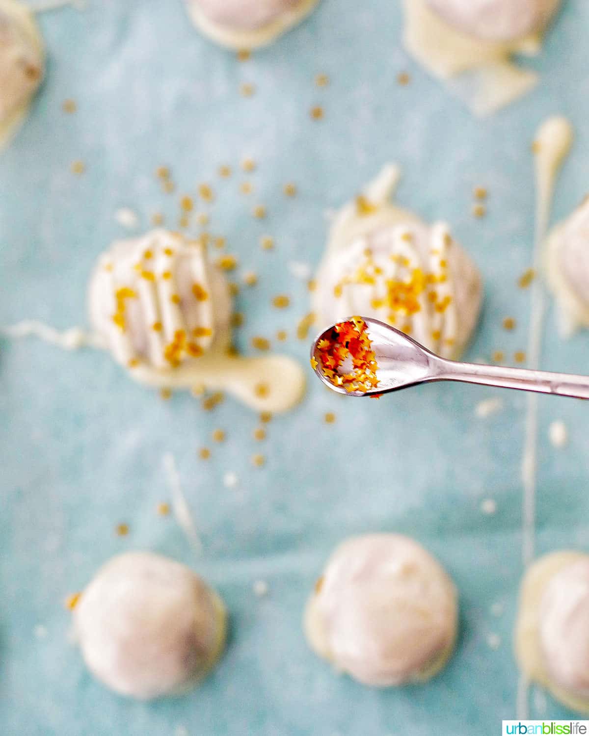 decorating chocolate chip cookie dough truffles with edible gold stars
