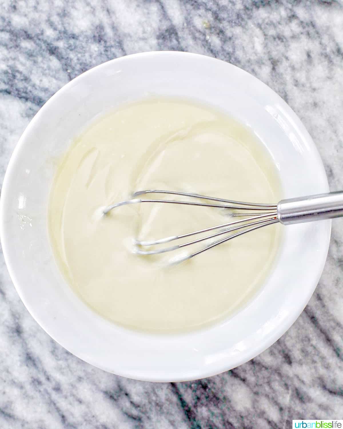 whisking melted white chocolate