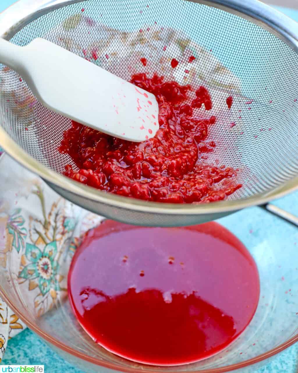 straining raspberries
