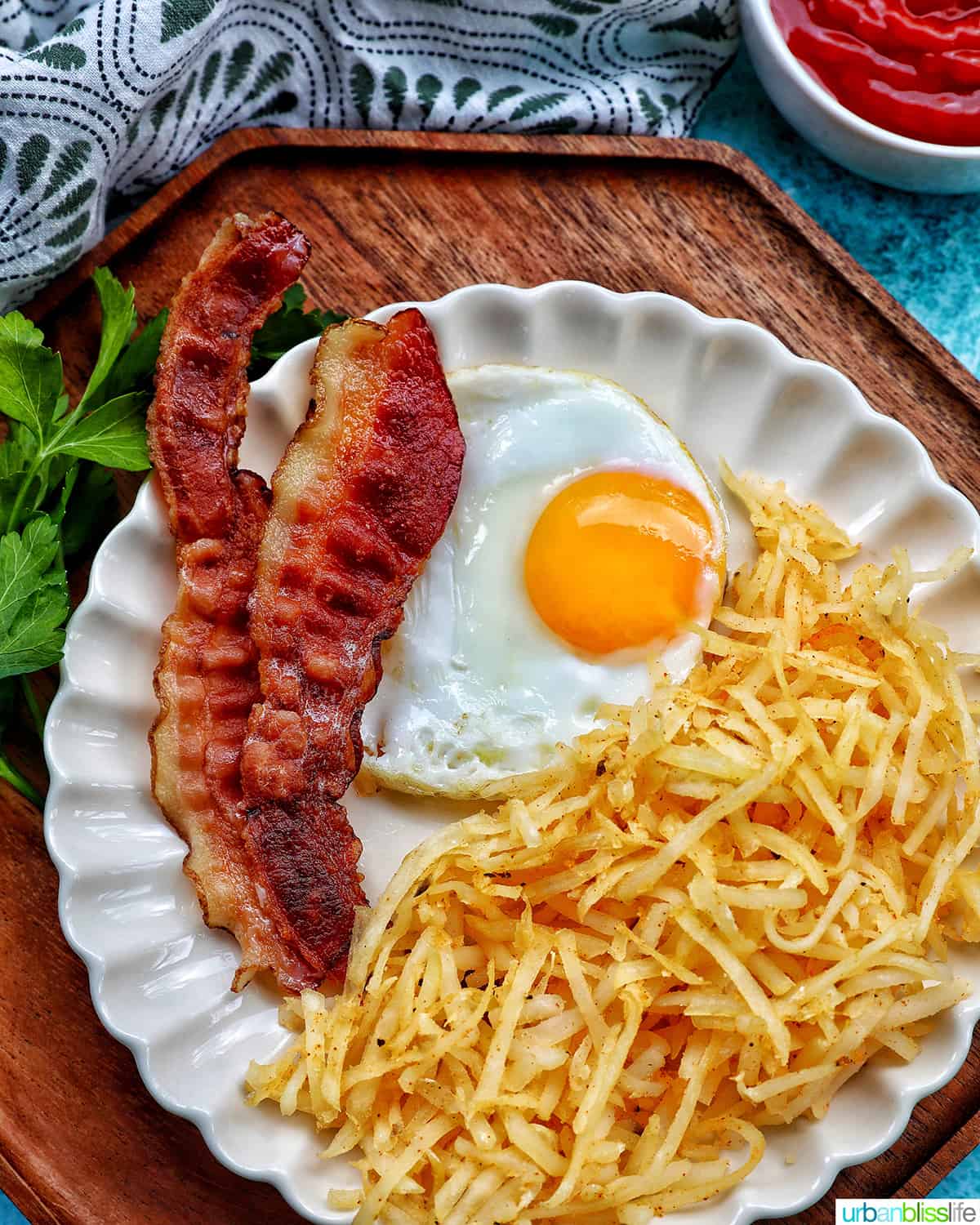 shredded air fryer hash browns with bacon and eggs
