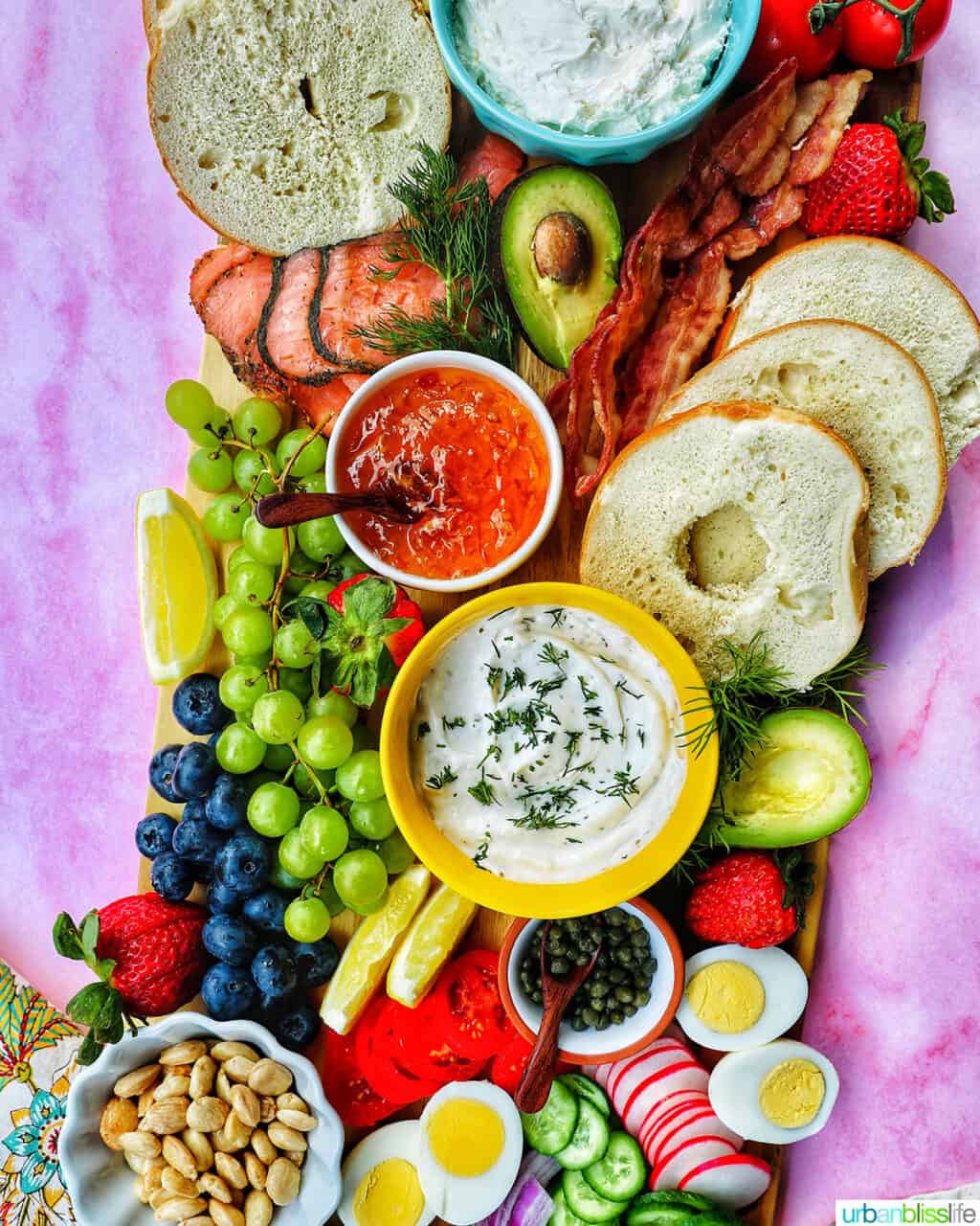 bagel brunch board on pink background