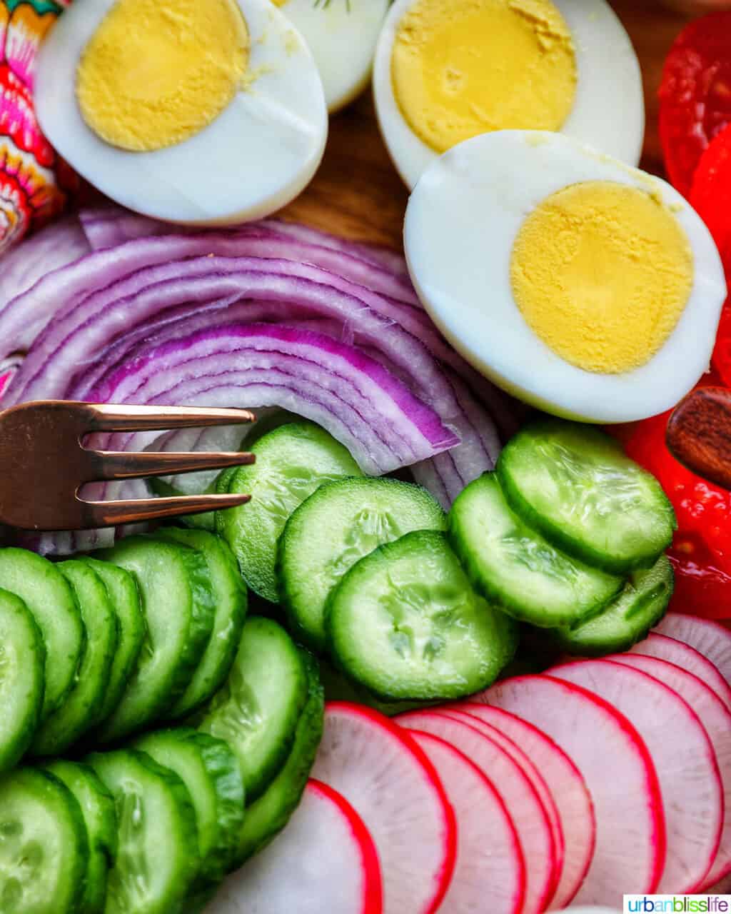 sliced vegetables and hard boiled eggs