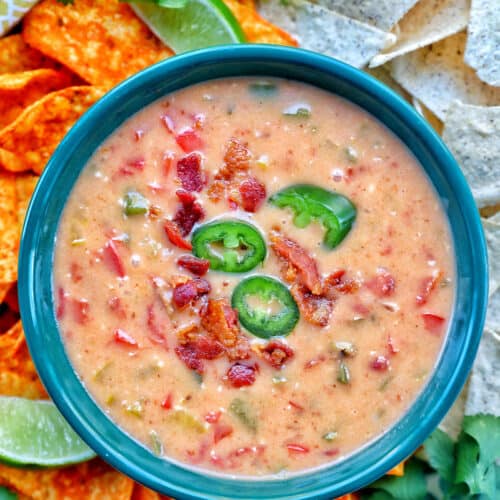 bowl of dairy free queso dip with nacho chips