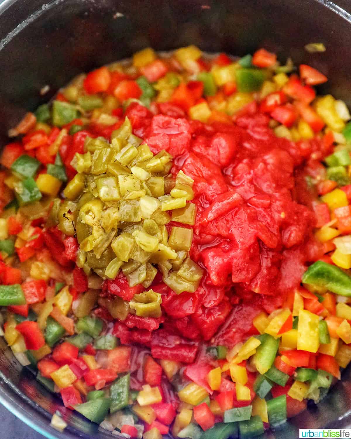 adding tomatoes and chillis