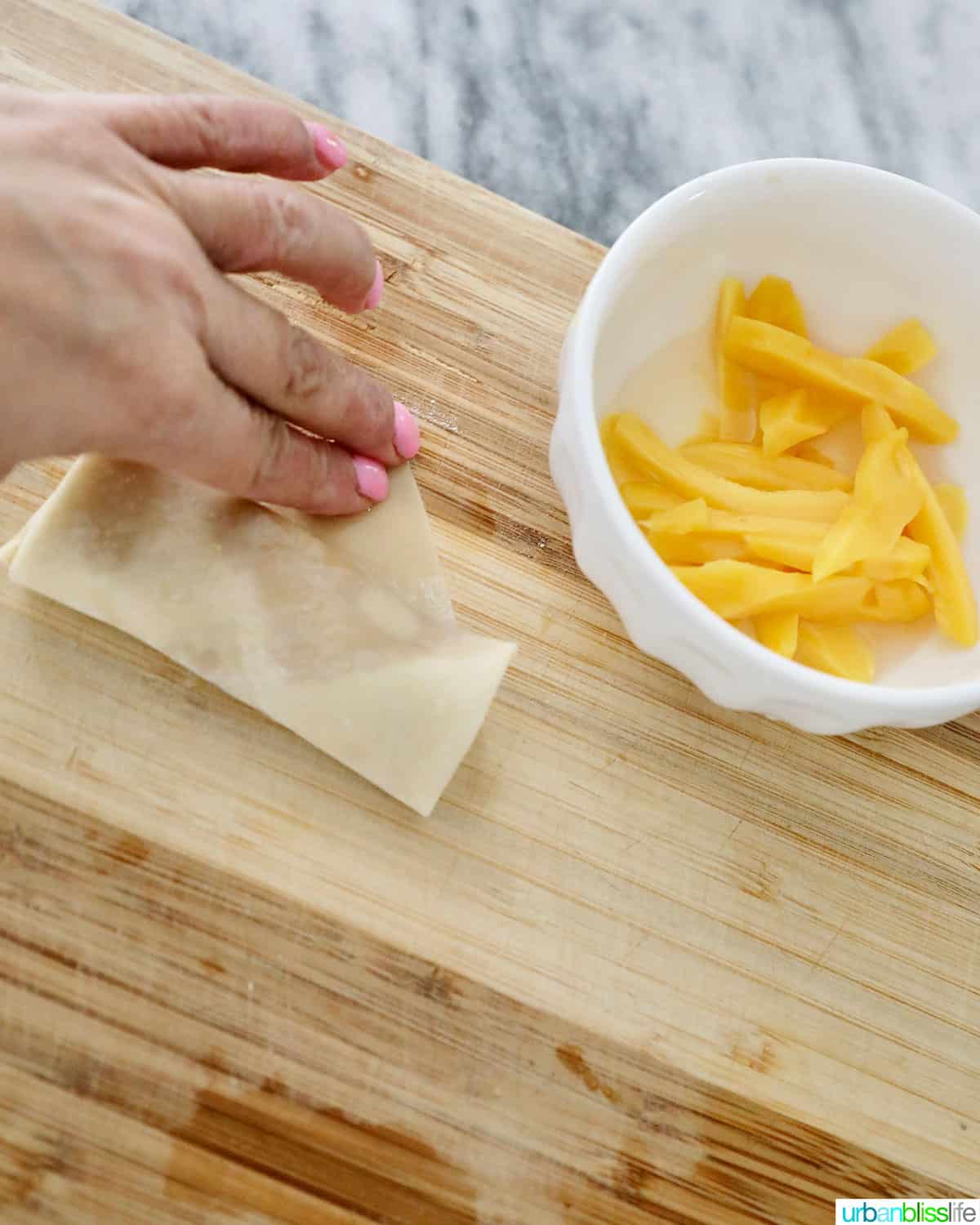folding Filipino turon banana lumpia