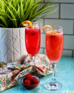 two glasses of Raspberry Mimosas