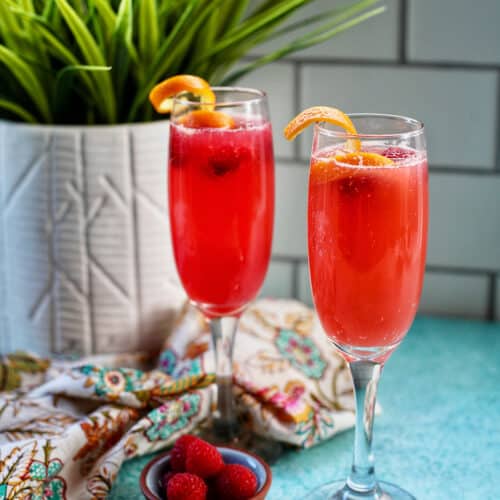 two glasses of Raspberry Mimosas