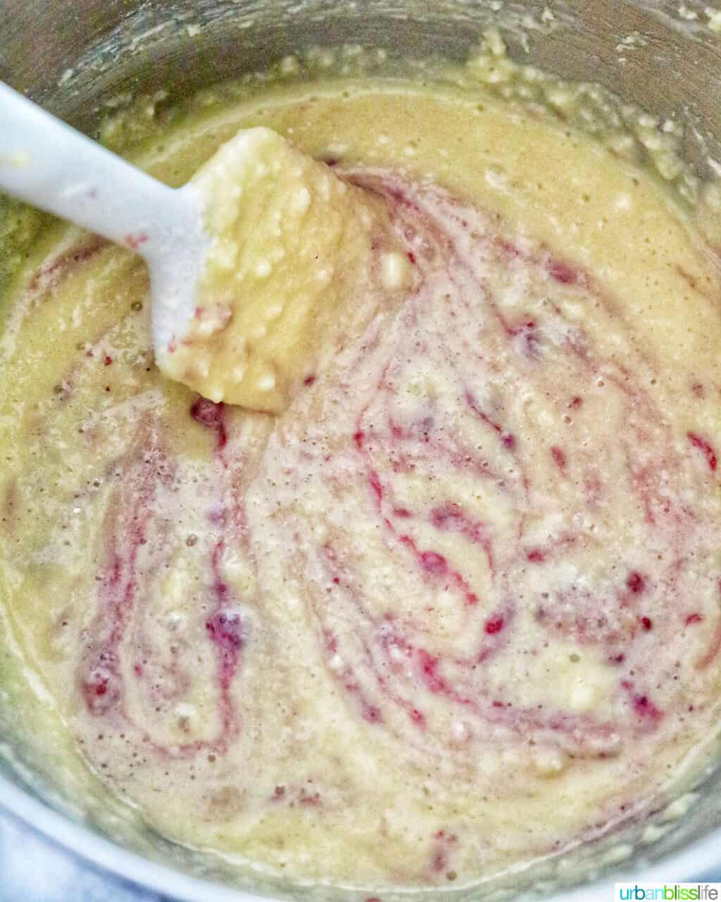 mixing batter for white chocolate raspberry bundt cake