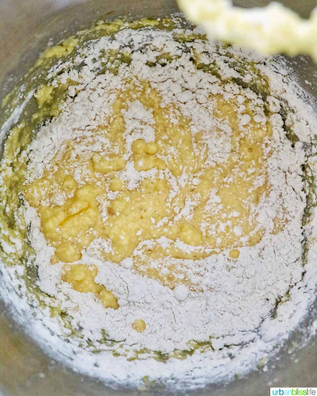mixing batter to make white chocolate raspberry bundt cake