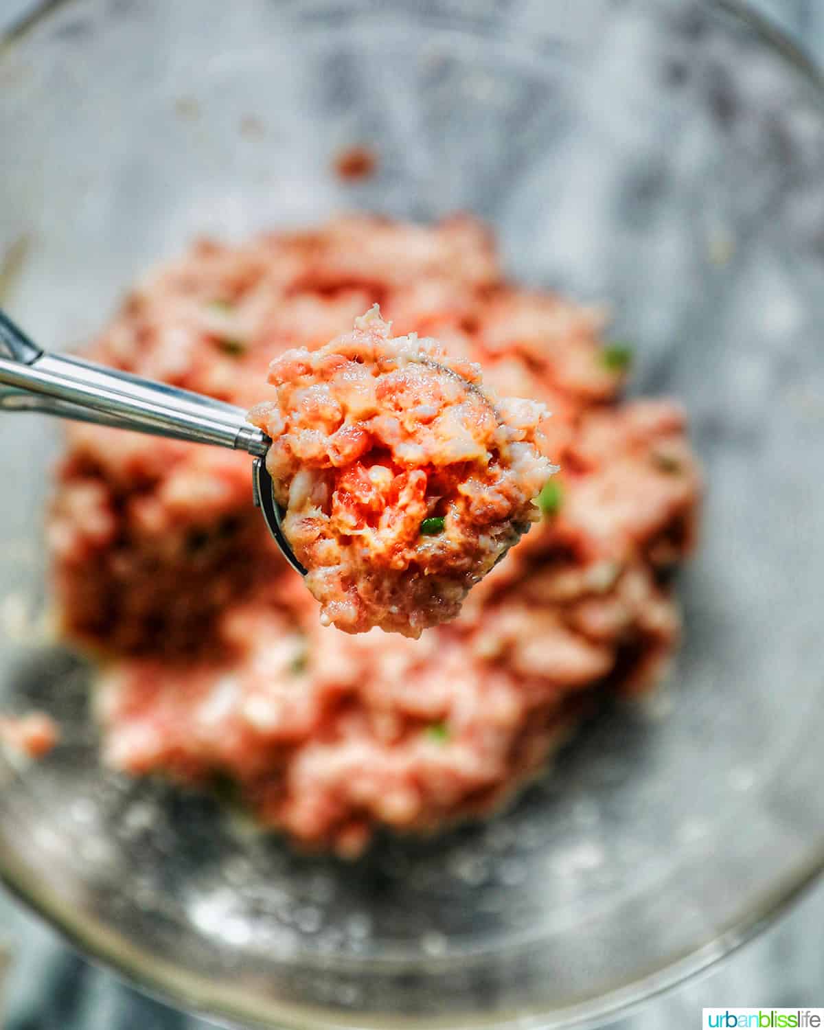 scooping meatball for almondigas