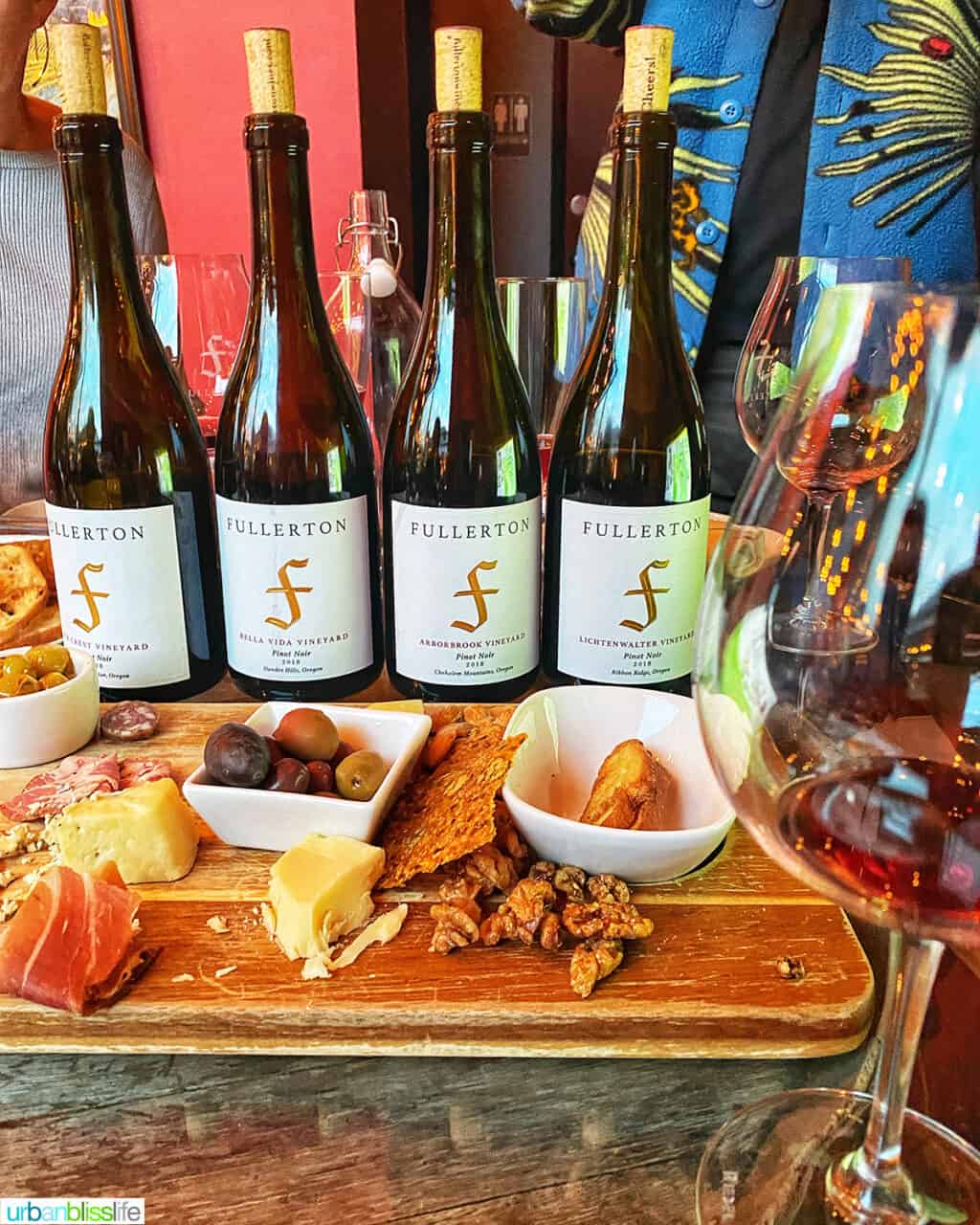 lineup of Fullerton Wine bottles and snacks
