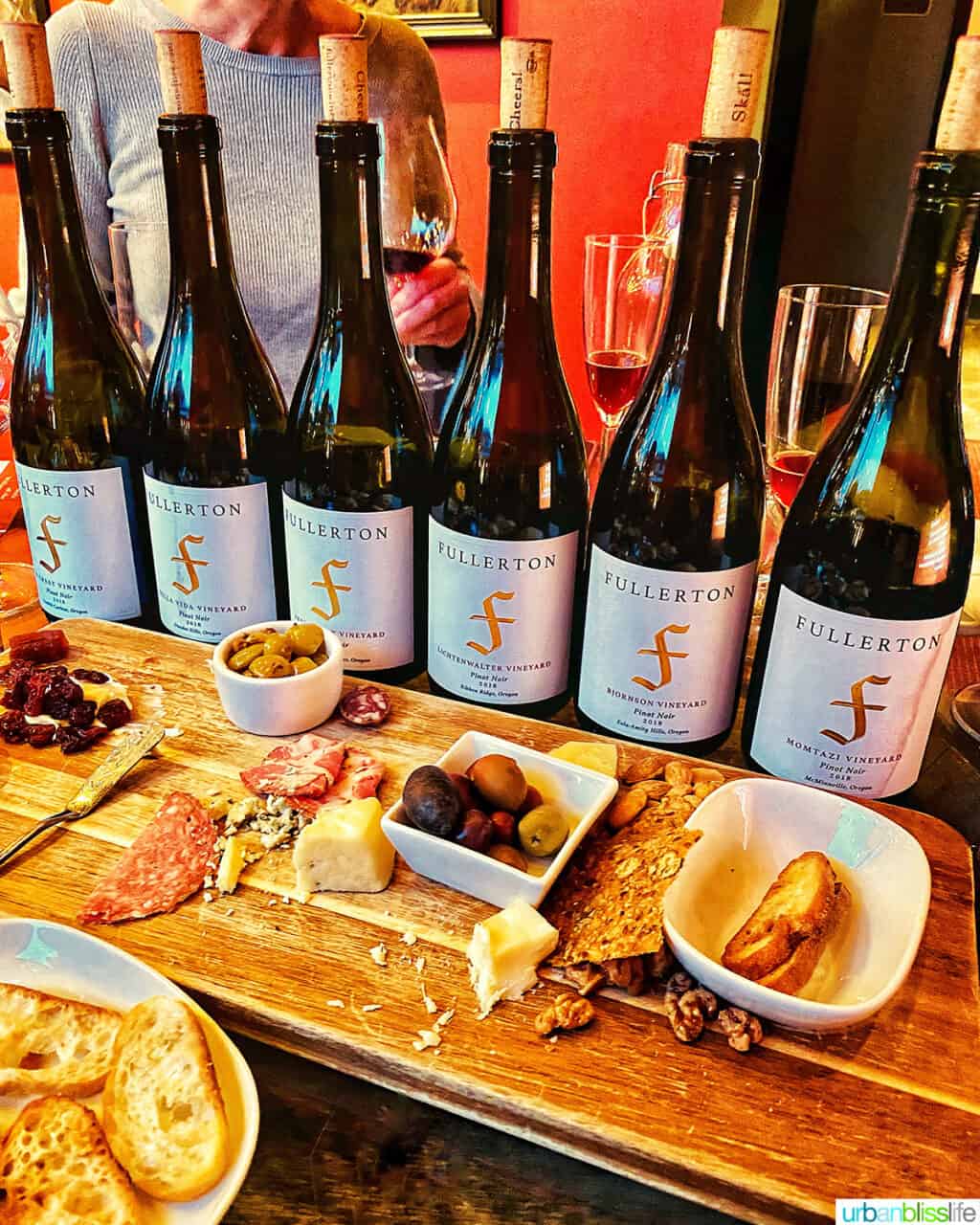 lineup of Fullerton Wine bottles and snacks