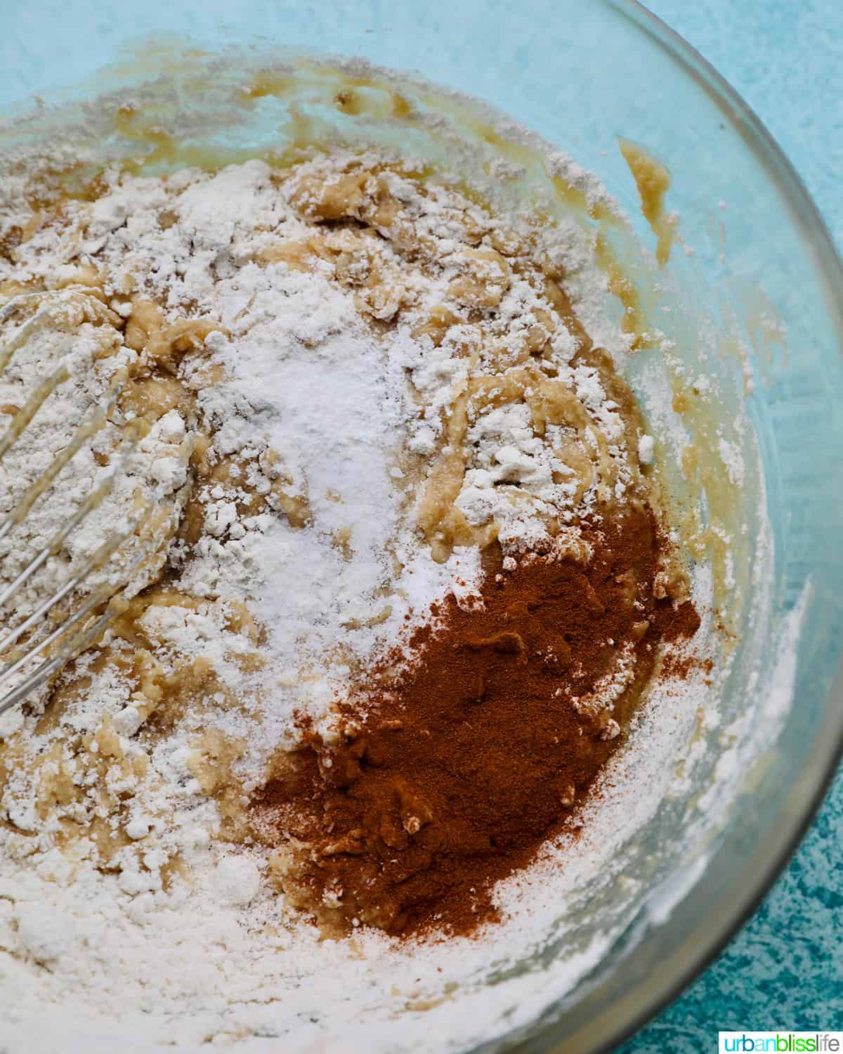 adding dry ingredients for banana bread cookies