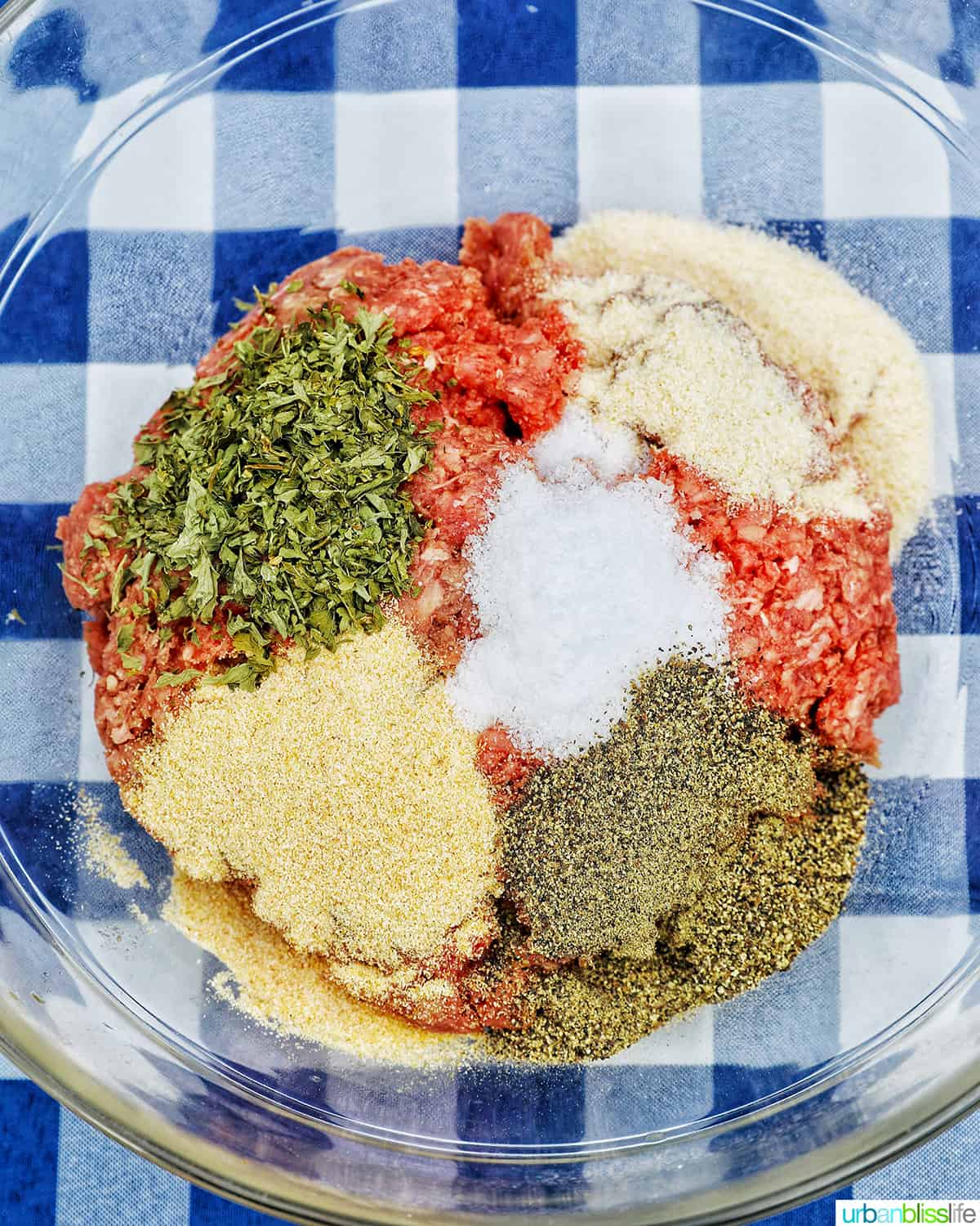 spices going into burger meat