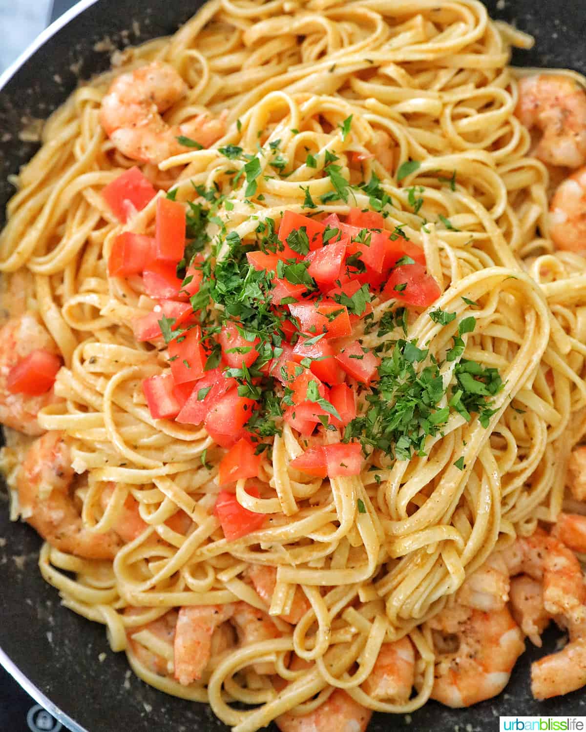 finishing Cajun Shrimp Pasta in the pan