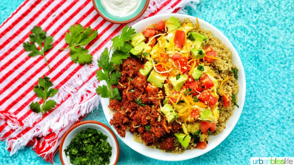 chirozo breakfast bowl with sides of sour cream and cilantro