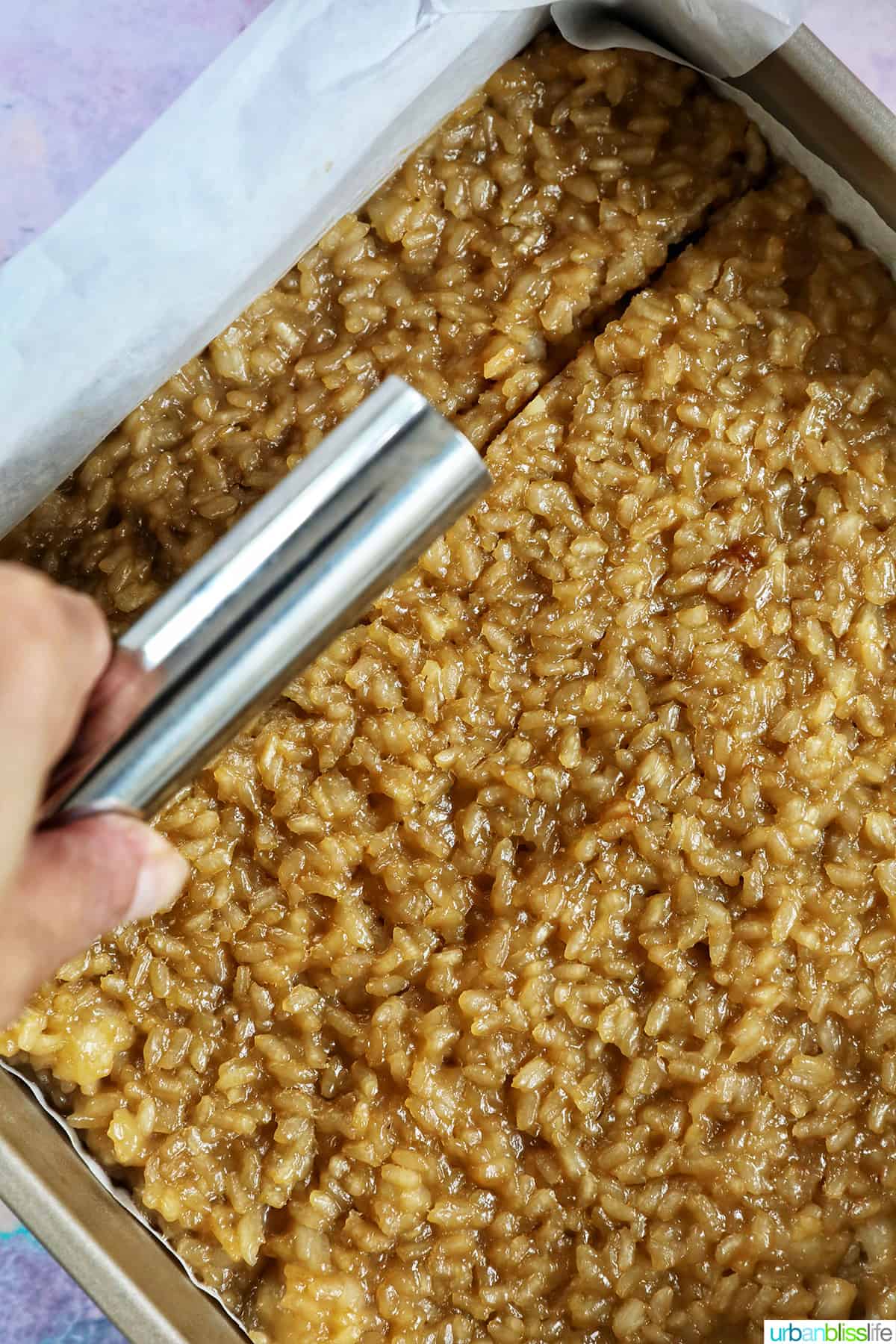 cutting filipino biko dessert with a pastry cutter.