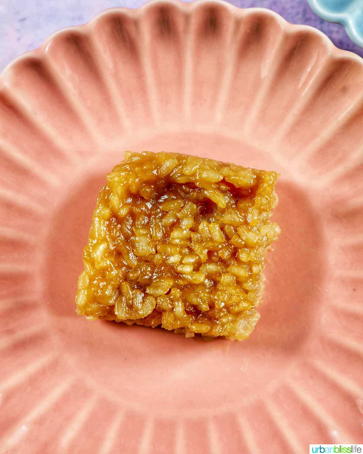slice of filipino biko on a pink plate.
